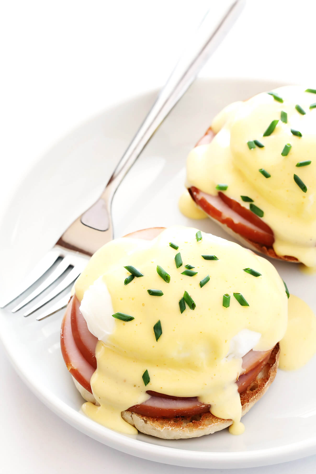 This is my favorite recipe for classic Eggs Benedict. The blender Hollandaise sauce is surprisingly easy to make, and so tasty! | gimmesomeoven.com